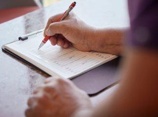 Person filling out a medical form