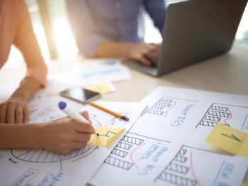 cropped-people-preparing-diagrams-project-presentation-scaled